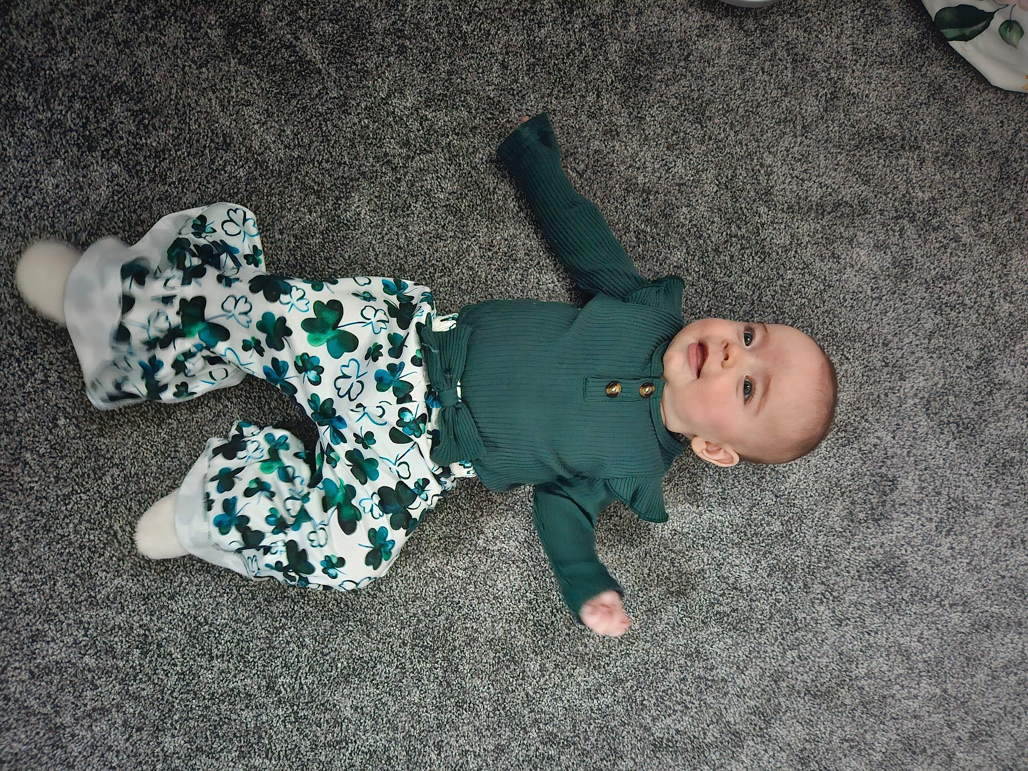 Nora is registered to the contest to win money with this photo: baby, baby_toddler_clothing, child, comfort, electric_blue, flooring, fun, grass, head, human_leg, pattern, person, play, room, shadow, sitting, sleeve, toddler, toy