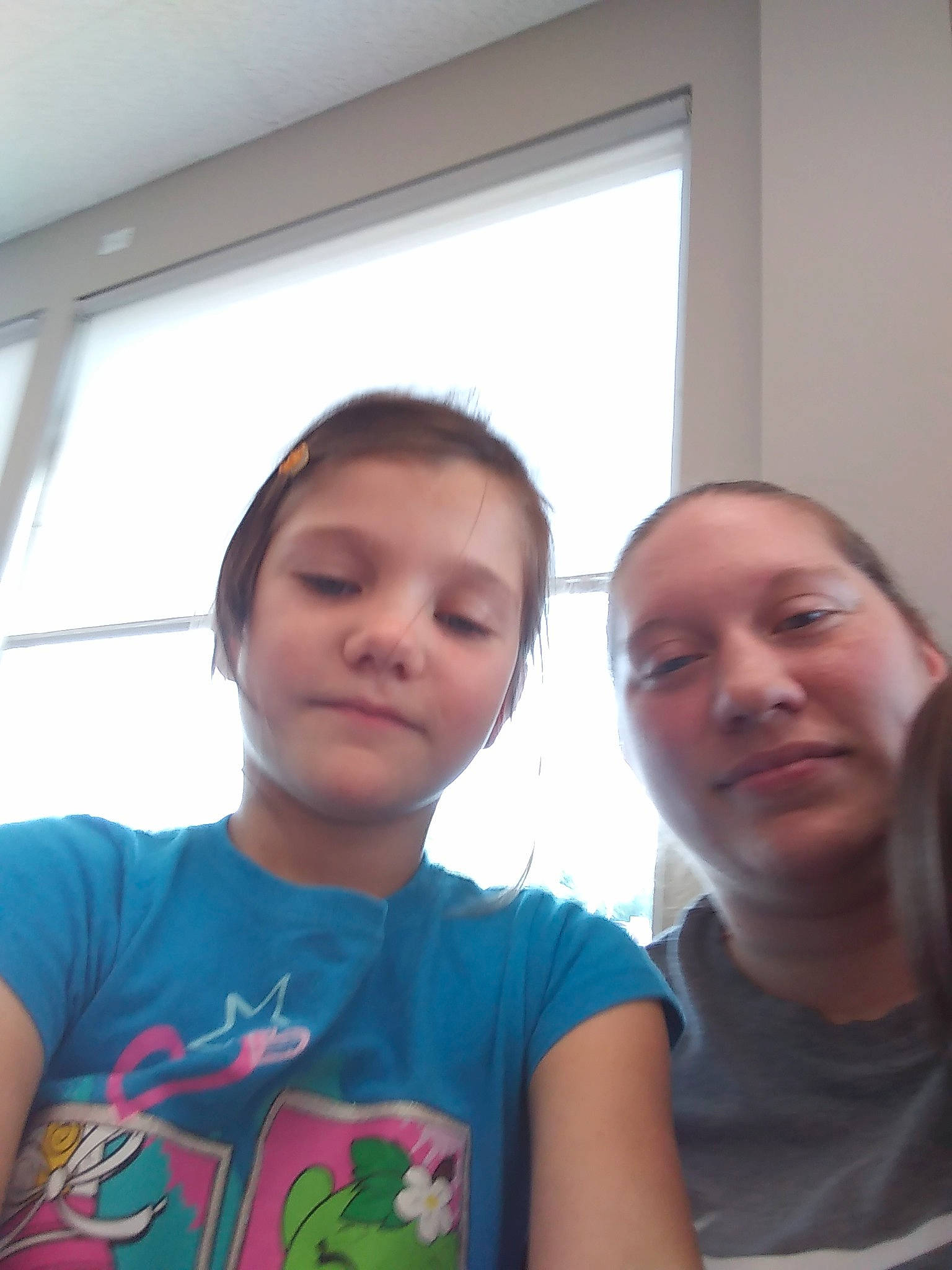 Emilee is registered to the contest to win money with this photo: child, chin, electronic_device, face, forehead, friendship, fun, happy, head, people, person, photography, room, selfie, skin, smile, summer, t_shirt, technology, toddler