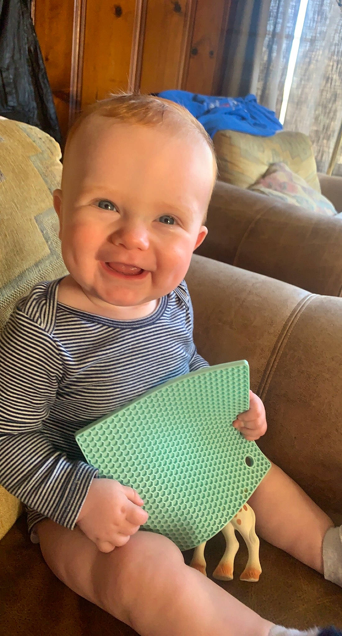 Axel is registered to the contest to win money with this photo: baby, baby_toddler_clothing, blue, cheek, chin, comfort, eye, face, facial_expression, finger, hairstyle, head, human_body, joy, nose, organ, person, skin, sleeve, smile