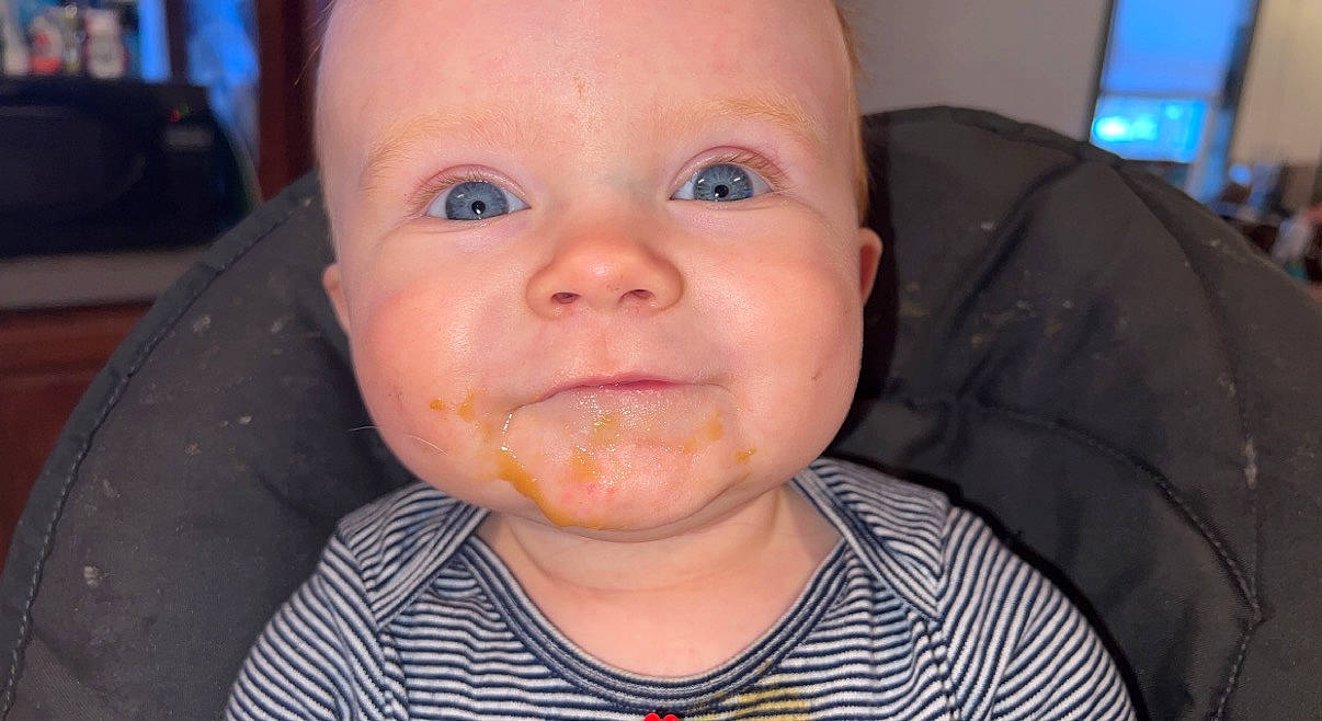Axel is registered to the contest to win money with this photo: baby, baby_playing_with_food, baby_toddler_clothing, cheek, clothing, ear, eyebrow, eyelash, happy, iris, jaw, lip, mouth, neck, nose, person, skin, smile, television, toddler
