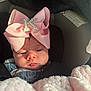 Kensley-May is registered to the contest to win money with this photo: baby, child, car_seat, pink_bow, blanket, infant, face, headwear, clothing, soft_texture, cute, indoors, portrait, young_child, seatbelt, baby_clothes, warm, comfort, closeup, expression
