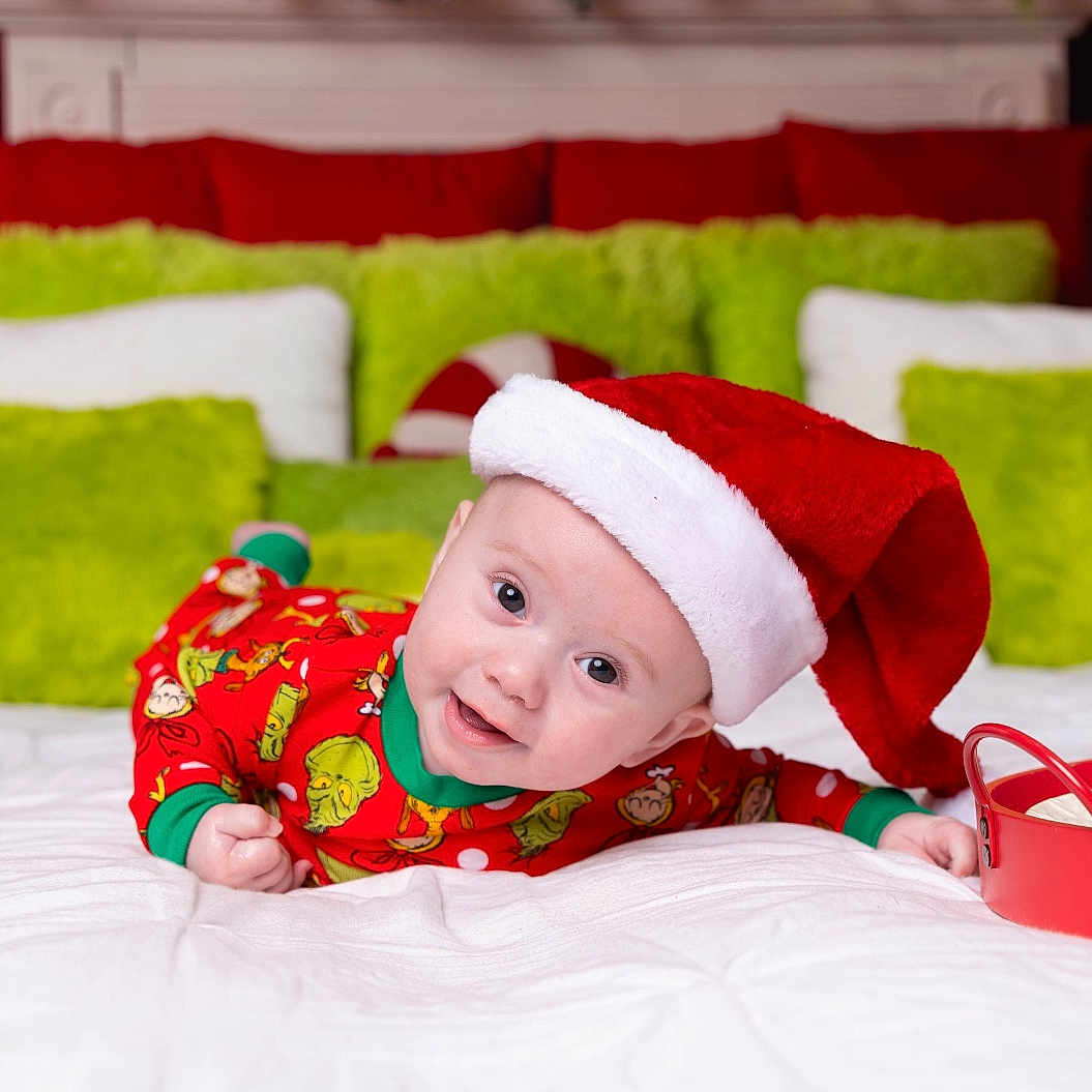 Leeland joined the competition — help win amazing prizes! baby, bed, child, christmas, christmas_tree, cookies, cute, face, festive, green, holiday, indoors, milk, pajamas, pillow, red, santa_hat, smiling, tray, white