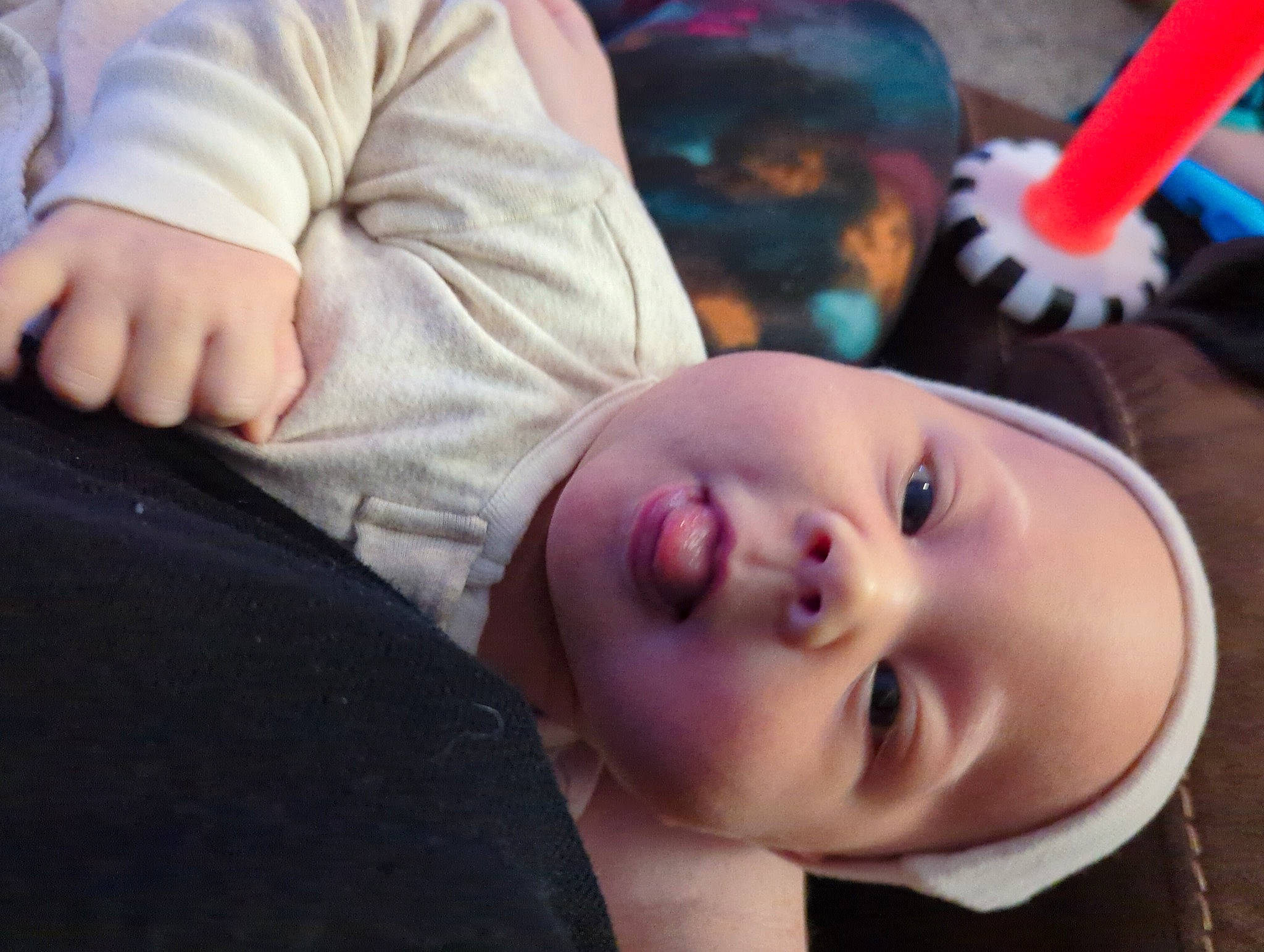 Weslie is registered to the contest to win money with this photo: baby, cheek, cool, ear, eye, eyebrow, eyelash, happy, head, headgear, human, human_body, lip, mammal, mouth, nose, person, purple, skin, smile