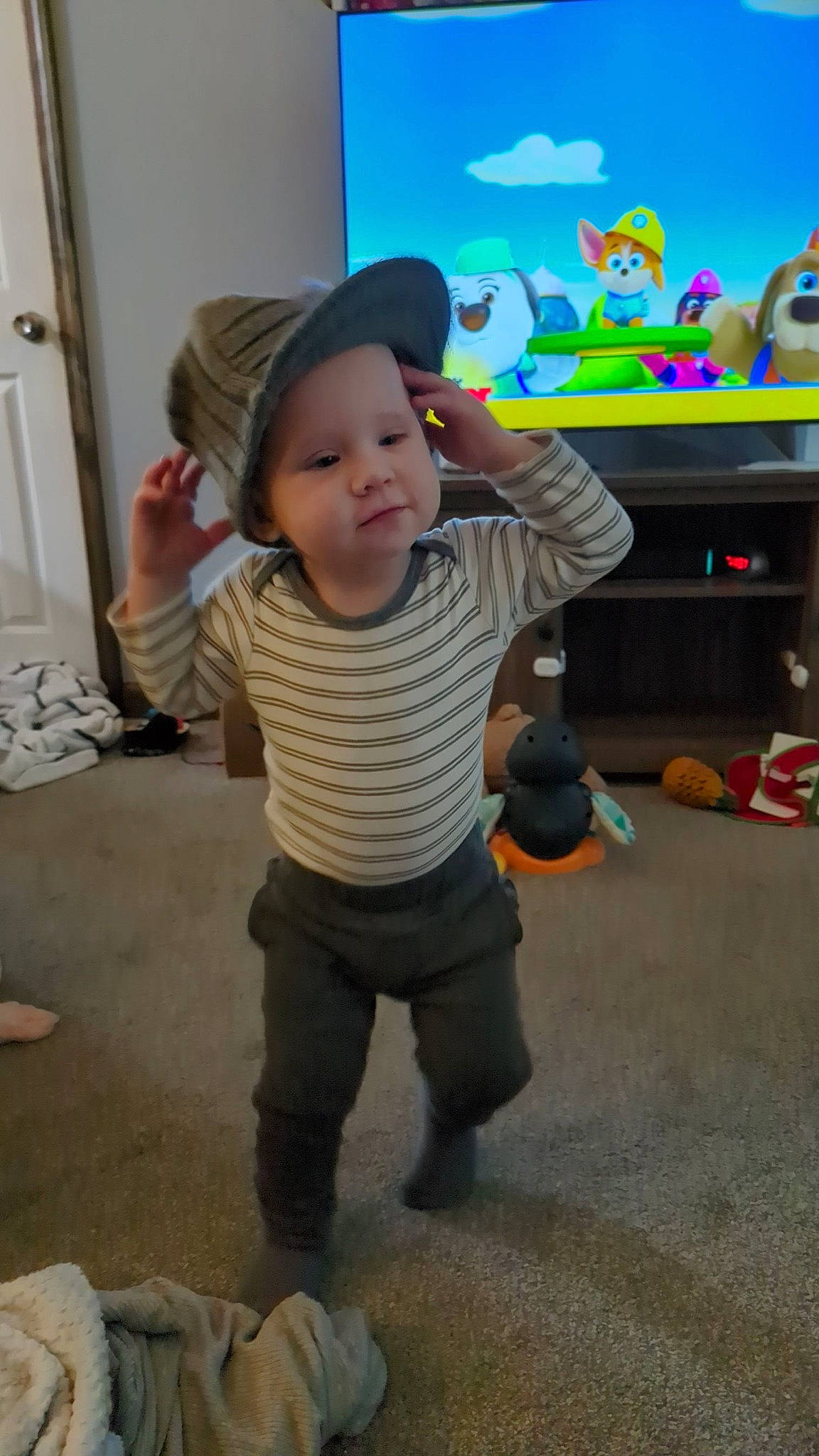 Spencer joined the competition — help win amazing prizes! baby, baby_toddler_clothing, child, display_device, floor, flooring, fun, headwear, led_backlit_lcd_display, leisure, output_device, person, play, room, standing, television, television_set, toddler, toy, vacation