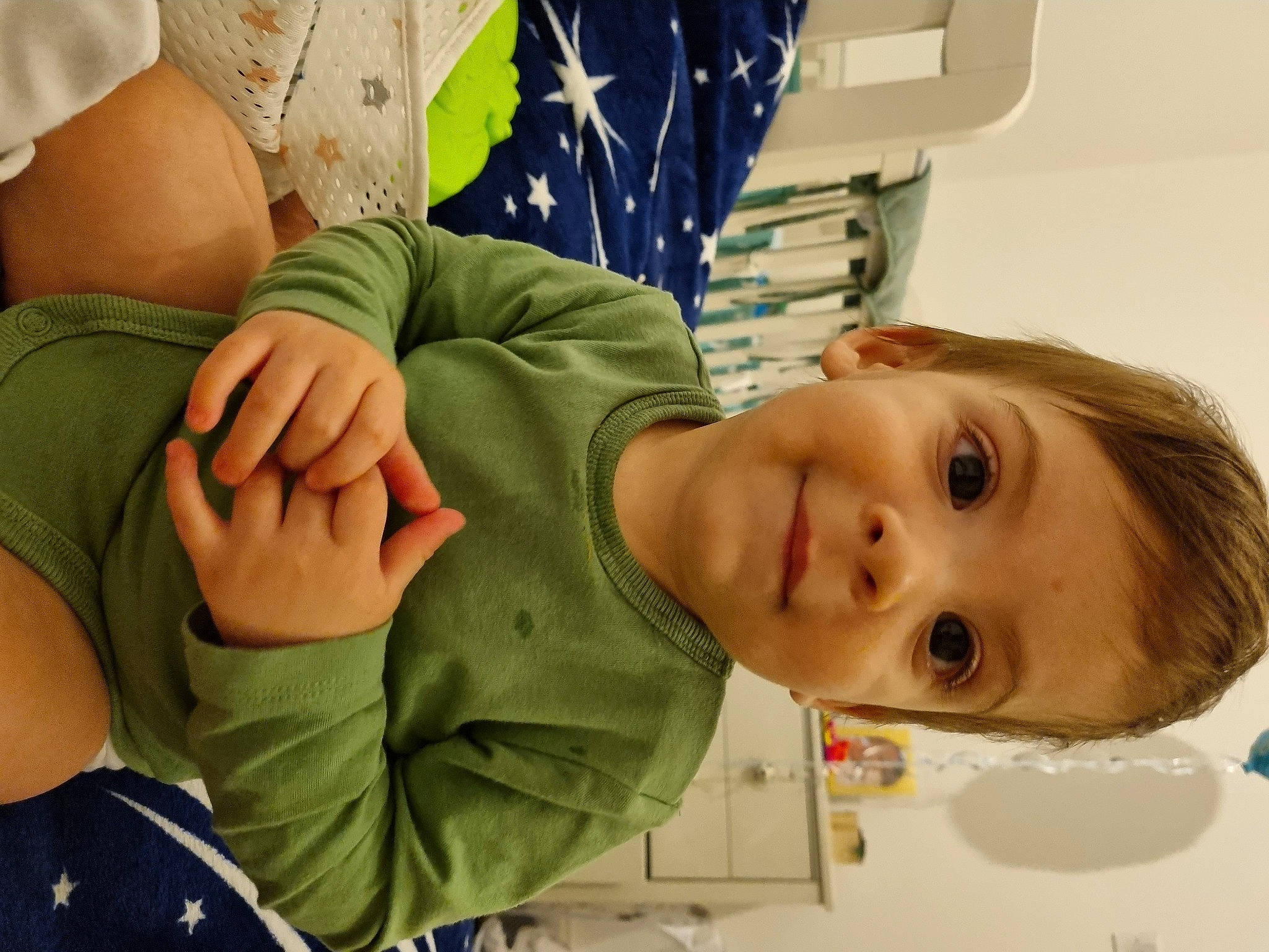 Dominic is registered to the contest to win money with this photo: abdomen, baby, cheek, child, comfort, elbow, eye, gesture, happy, joy, mouth, neck, nose, person, room, sitting, skin, sleeve, smile, thumb