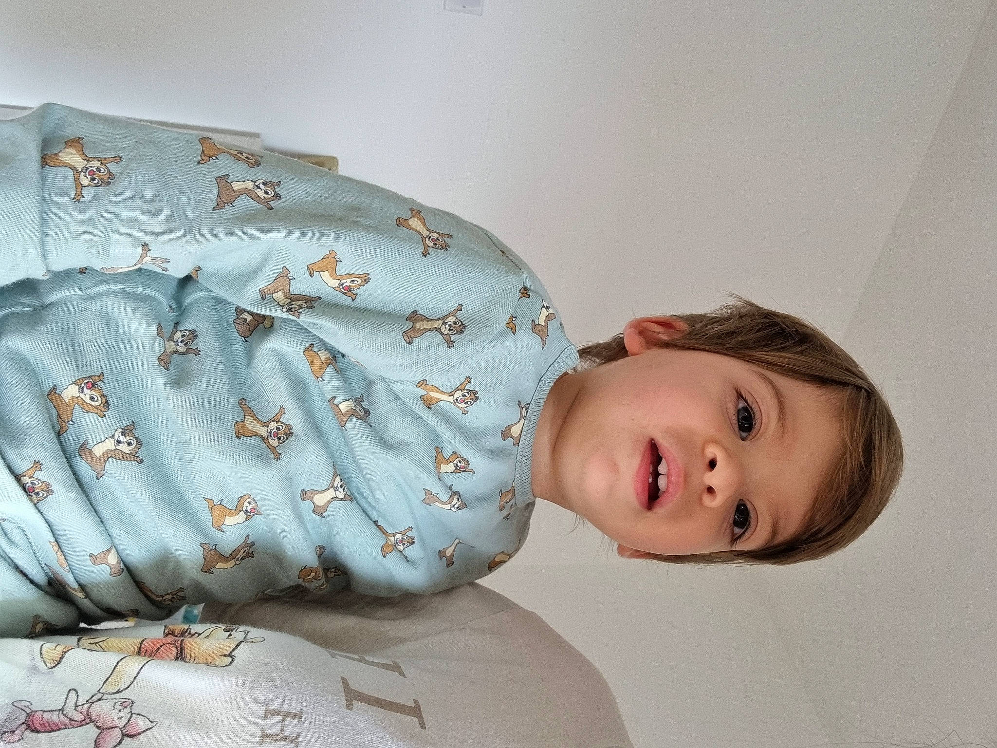 Dominic is registered to the contest to win money with this photo: abdomen, bed, bed_sheet, bedding, bedroom, child, comfort, couch, face, fashion_accessory, happy, head, linens, pattern, person, pillow, portrait_photography, room, sitting, sleeve