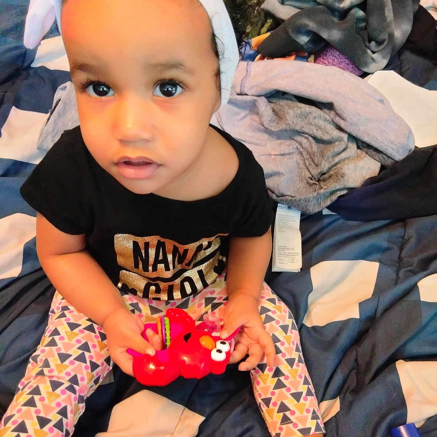 Moette joined the competition — help win amazing prizes! baby, bodypart, clothing, couch, cushion, face, finger, furniture, hand, hat, head, homedecor, indoors, pants, person, photography, portrait, sitting, t_shirt, toy