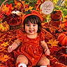 Georgina is registered to the contest to win money with this photo: baby, child, infant, autumn, fall, pumpkin, pumpkin_costume, orange, dress, hat, socks, smiling, tongue_out, sitting, portrait, outdoor, garden, leaves, harvest, milestone_sign