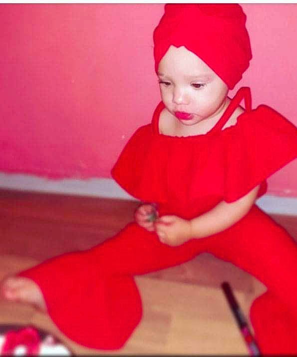 Antonia joined the competition — help win amazing prizes! baby, baby_toddler_clothing, beanie, cap, carmine, christmas_eve, costume_hat, fictional_character, happy, hat, headgear, headwear, lap, linens, magenta, person, pink, room, sitting, sleeve