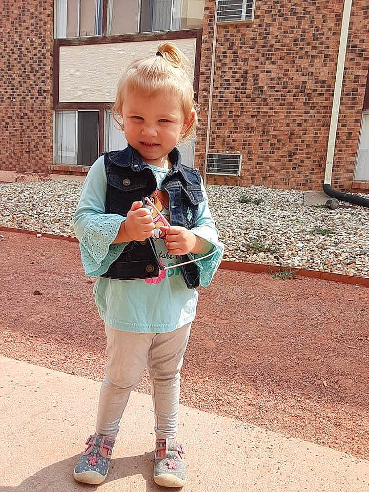 Clarissa is registered to the contest to win money with this photo: blond, brick, brickwork, denim, electric_blue, human_body, leg, pattern, person, plaid, shoulder, sleeve, smile, sportswear, standing, street_fashion, t_shirt, tie, toddler, waist