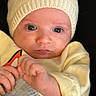 John joined the competition — help win amazing prizes! baby, child, closeup, cute, expression, eyes, face, hands, hat, indoors, infant, knit_hat, newborn, person, portrait, skin, soft_light, warm_clothing, yellow_clothing, young