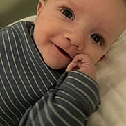 John joined the competition — help win amazing prizes! baby, blanket, blue_clothing, child, cute, eyes, face, hand, happy, indoors, infant, lying_down, mouth, person, portrait, skin, smiling, soft, striped_clothing, young