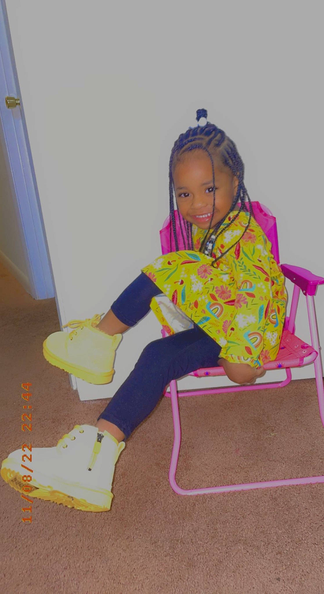 Nariyah is registered to the contest to win money with this photo: baby_toddler_clothing, chair, child, fashion_design, flooring, foot, fun, happy, human_leg, joy, knee, leisure, magenta, pattern, person, sitting, sleeve, smile, sock, standing