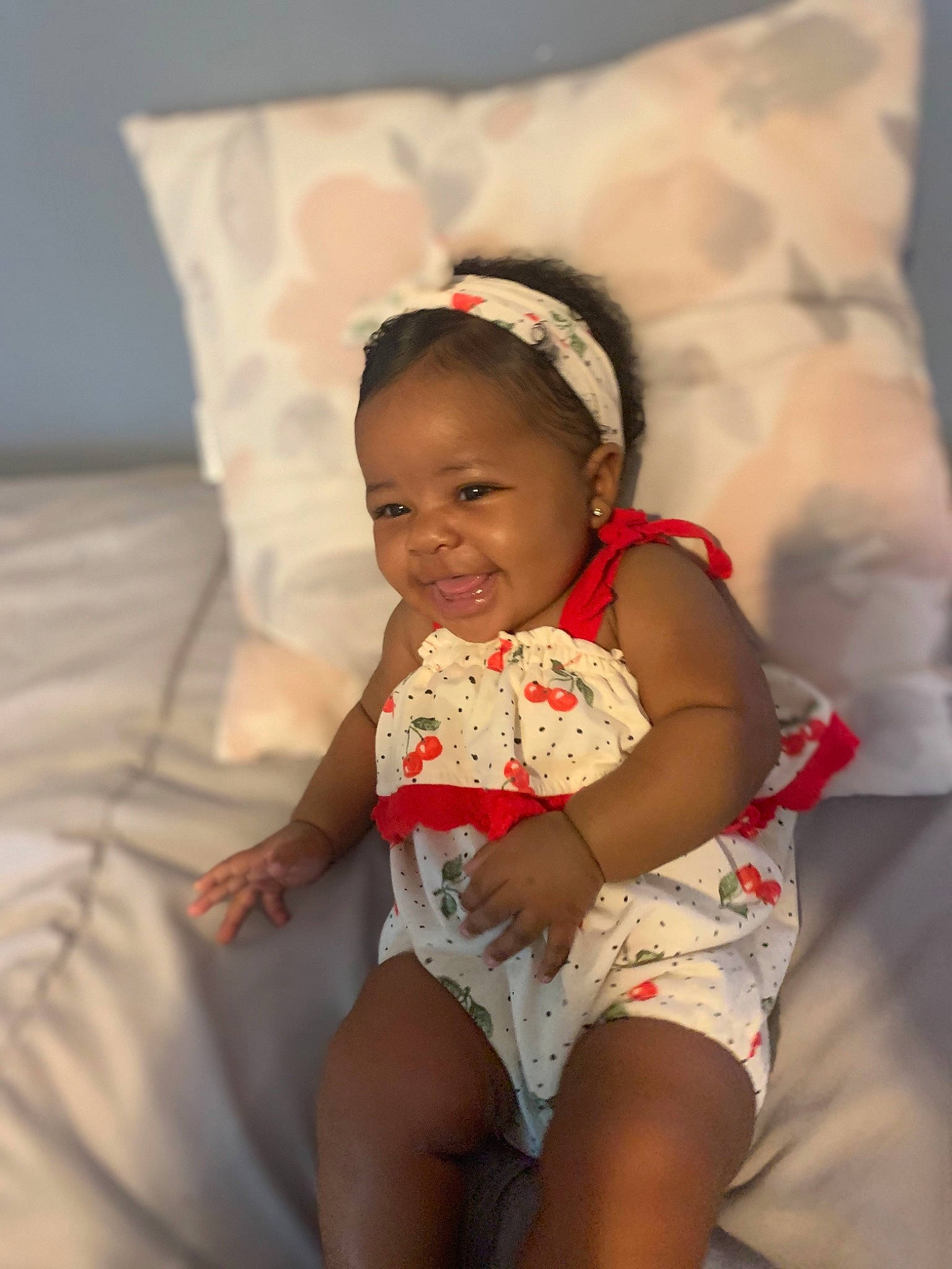 Nariyah joined the competition — help win amazing prizes! abdomen, arm, baby, child, fun, hair_accessory, joy, leg, person, sitting, skin, smile, textile, toddler