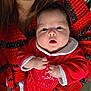 Amelia participe au concours pour gagner de l'argent avec cette photo : baby, infant, child, person, red_clothing, sweater, holiday, christmas, festive, cute, holding, portrait, face, hands, expression, indoor, warm, cozy, family, love