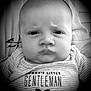 baby, infant, face, portrait, black_and_white, clothing, striped, onesie, text_on_clothing, bow_tie, expression, serious, close_up, person, child, young, cute, indoors, monochrome, head