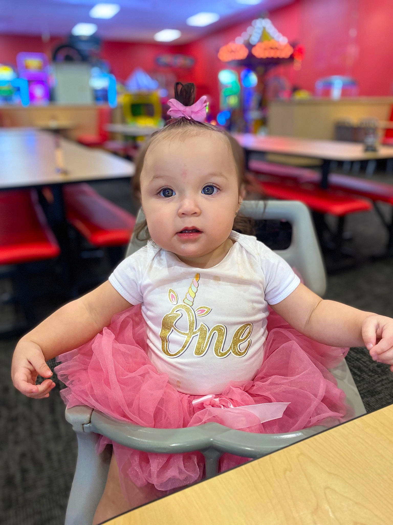 Maliah is registered to the contest to win money with this photo: baby, baby_toddler_clothing, chair, cheek, child, desk, event, flooring, fun, happy, leisure, magenta, person, pink, room, sitting, skin, snapshot, surprise, table