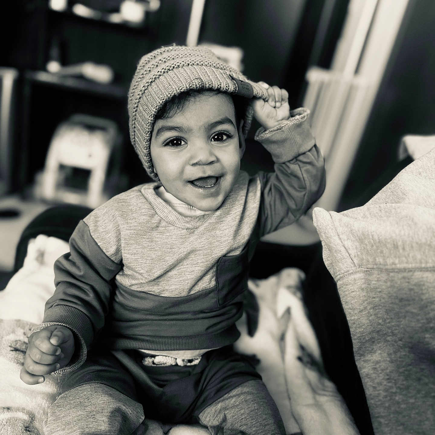 Raysean is registered to the contest to win money with this photo: baby, baseballcap, beanie, bodypart, bonnet, cap, clothing, couch, face, finger, furniture, hand, happy, hat, head, pants, person, photography, portrait, smile