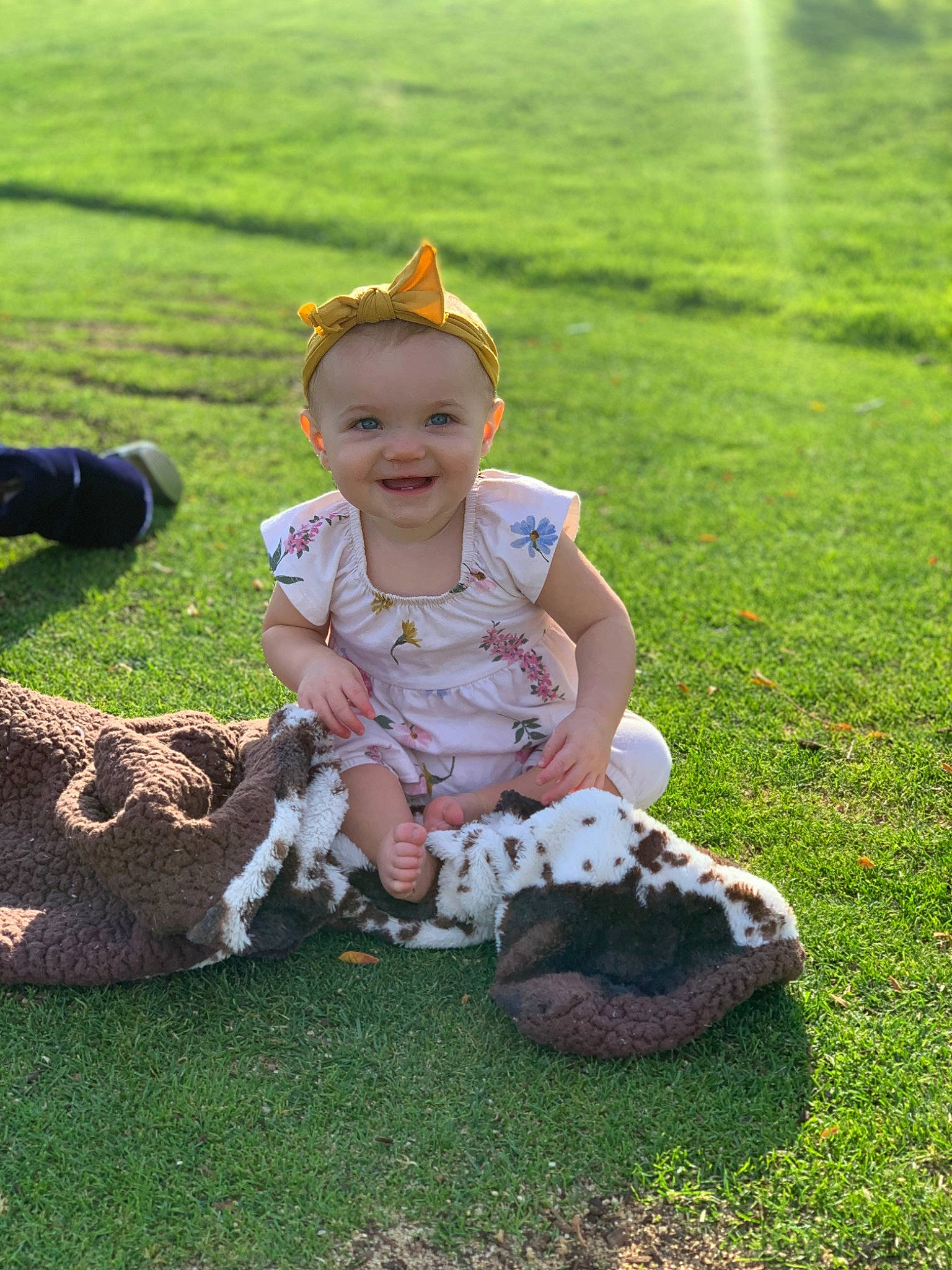 Araceli joined the competition — help win amazing prizes! baby, baby_toddler_clothing, child, fun, grass, grass_family, grassland, happy, hat, headgear, joy, landscape, lawn, leaf, leisure, nature, people_in_nature, person, recreation, sitting