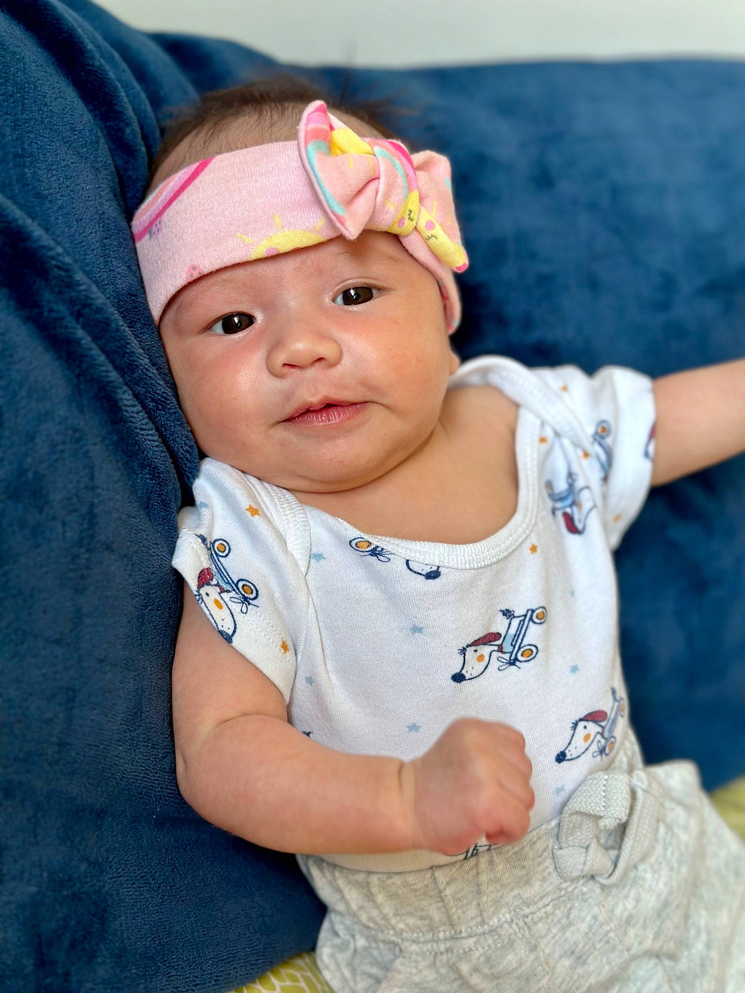 Chloe is registered to the contest to win money with this photo: baby, baby_toddler_clothing, cap, cheek, child, electric_blue, eye, eyelash, fashion_accessory, fun, grass, happy, headgear, headwear, iris, lip, pattern, person, skin, sleeve