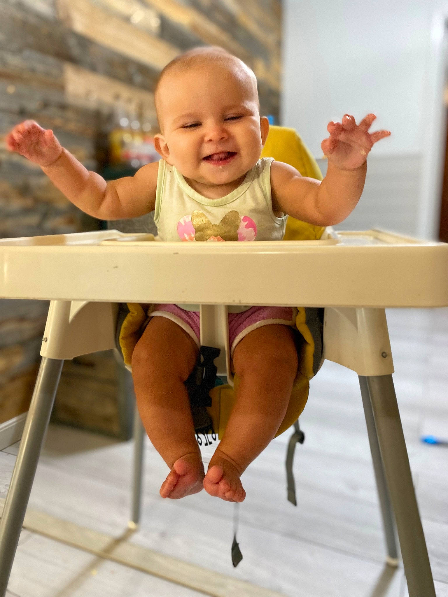 Madilynn is registered to the contest to win money with this photo: baby, baby_toddler_clothing, chair, child, comfort, hand, happy, human_body, joint, joy, leisure, person, shorts, sitting, skin, sleeve, smile, t_shirt, table, thumb