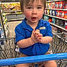 Sebastian joined the competition — help win amazing prizes! toddler, child, shopping_cart, blue_shirt, grocery_store, aisle, clothing, face, hands, expression, indoor, retail, sitting, cute, young_child, person, casual, shorts, toy, shopping
