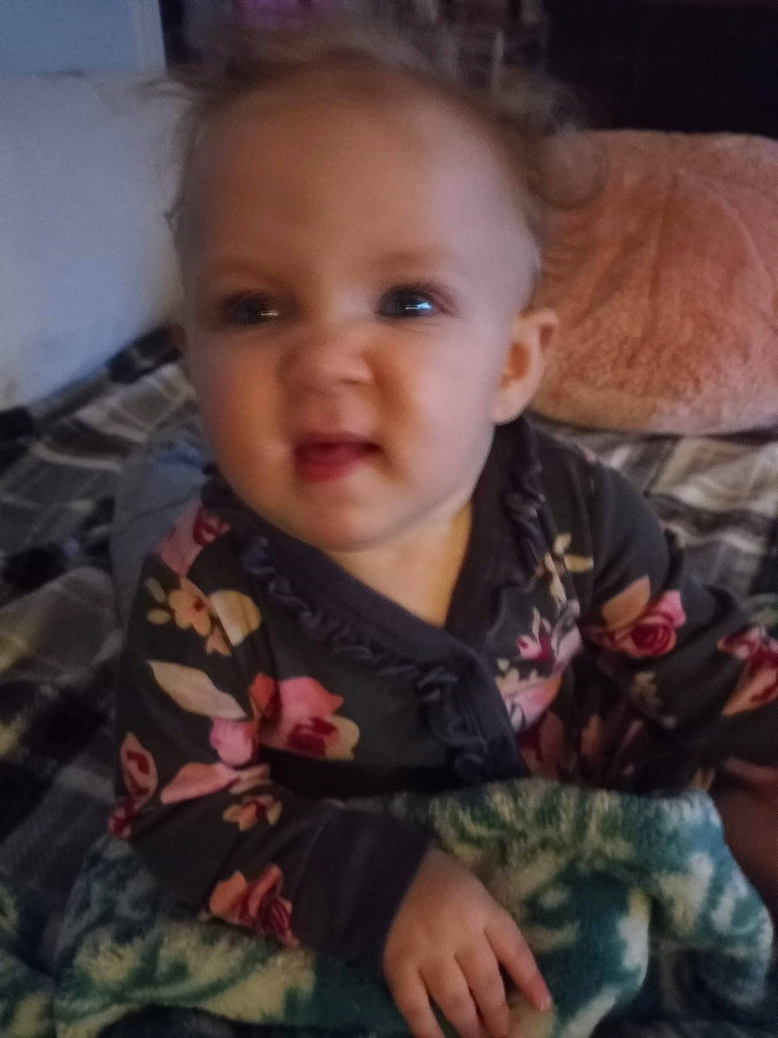 Kinzlee is registered to the contest to win money with this photo: baby_toddler_clothing, camouflage, cheek, comfort, ear, eye, eyebrow, face, gesture, hairstyle, head, human_body, iris, lip, military_camouflage, mouth, nose, person, skin, sleeve