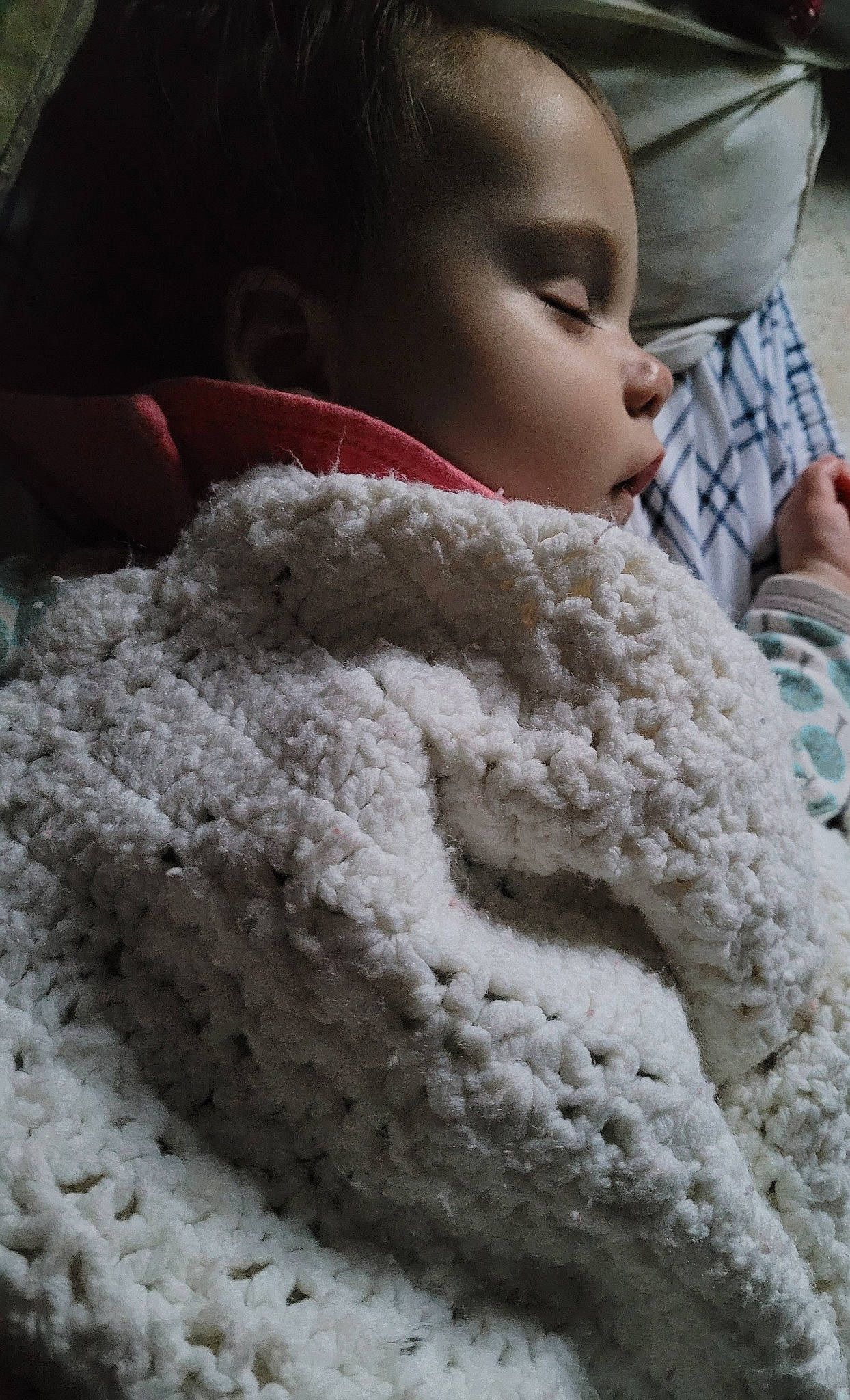 Arlyn is registered to the contest to win money with this photo: baby, baby_toddler_clothing, cheek, child, close_up, comfort, craft, flooring, fur, hand, headgear, linens, nose, photograph, skin, toddler, white, wool, woolen, woven_fabric
