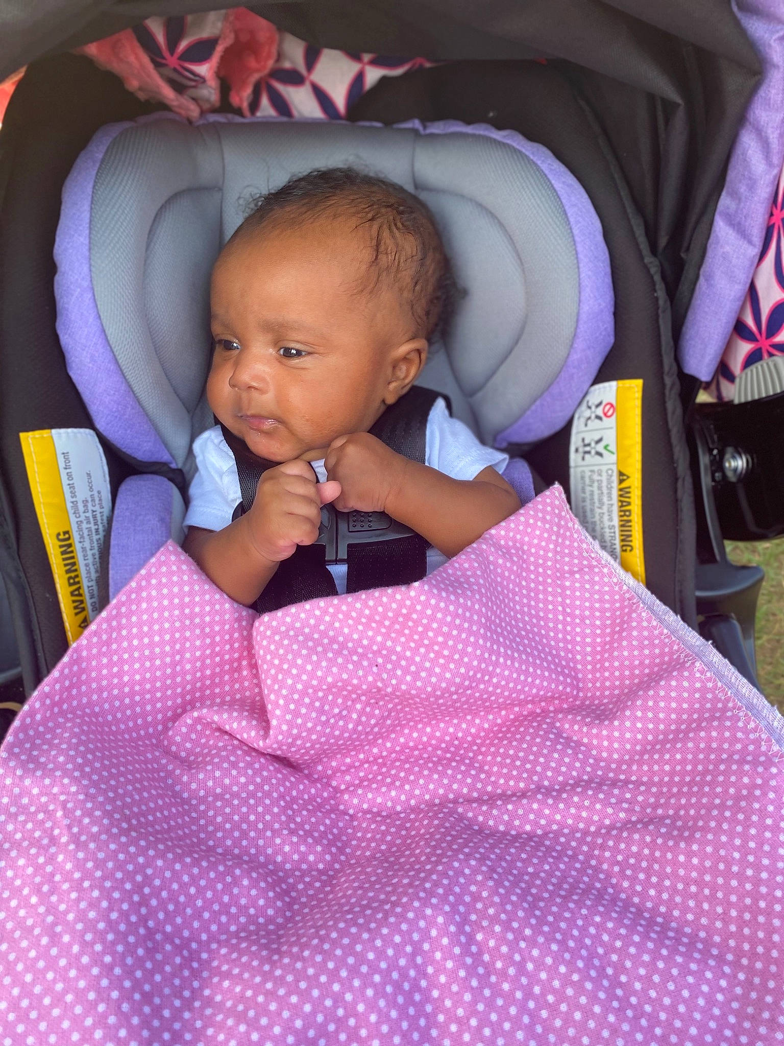 Nia joined the competition — help win amazing prizes! baby, baby_carriage, baby_products, baby_toddler_clothing, bag, car_seat, chair, child, comfort, finger, fun, linens, magenta, pattern, person, pink, purple, sitting, tartan, toddler