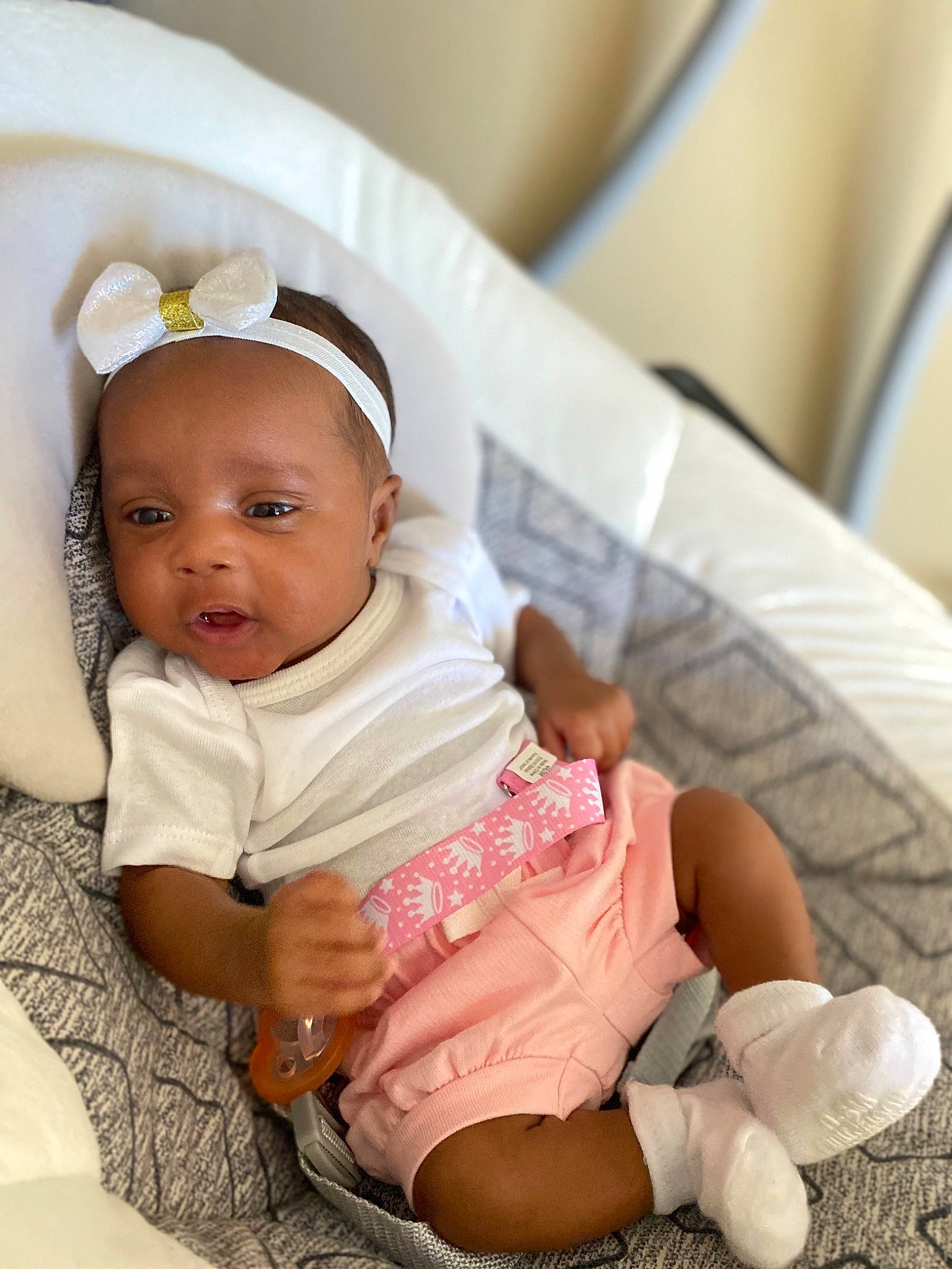 Nia joined the competition — help win amazing prizes! arm, baby, baby_products, baby_toddler_clothing, child, comfort, fashion_accessory, happy, headband, headpiece, jewellery, linens, nail, pattern, person, sitting, skin, sleeve, sock, toddler