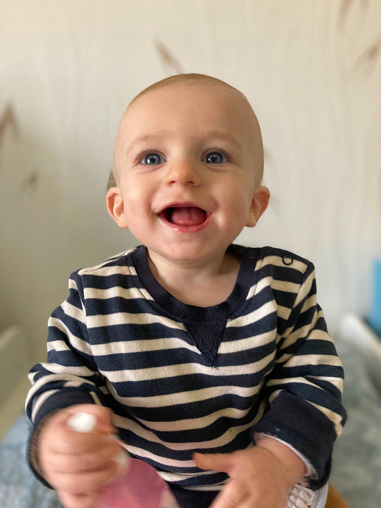 Sasha participe au concours pour gagner de l'argent avec cette photo : arm, baby, baby_toddler_clothing, cheek, child, chin, comfort, facial_expression, finger, flash_photography, flooring, gesture, happy, joy, mouth, person, skin, sleeve, smile, standing