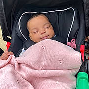 Vivienne joined the competition — help win amazing prizes! baby, sleeping, stroller, blanket, pink, pacifier, infant, child, cozy, knitted, peaceful, cute, black, comfort, portrait, closeup, resting, young, outdoor, relaxation