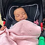 baby, sleeping, stroller, blanket, pink, pacifier, infant, child, cozy, knitted, peaceful, cute, black, comfort, portrait, closeup, resting, young, outdoor, relaxation