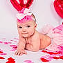 Gracie joined the competition — help win amazing prizes! baby, infant, tutu, headband, pink, red, heart_balloon, rose_petals, cute, posing, studio, portrait, child, smiling, bare_skin, adorable, celebration, festive, soft_lighting, white_background