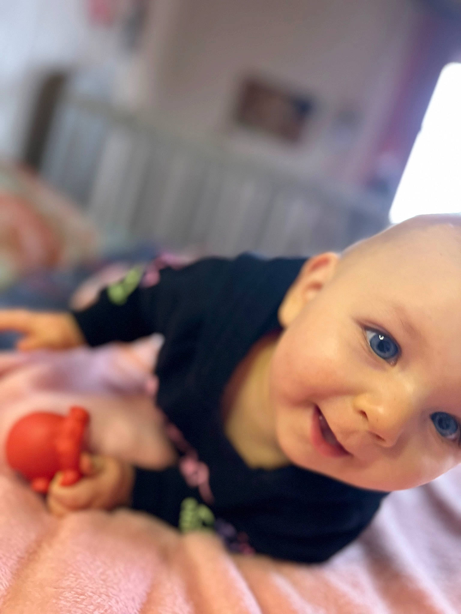 Inaya participe au concours pour gagner de l'argent avec cette photo : baby, baby_products, baby_toddler_clothing, cheek, child, eyelash, finger, flooring, happy, lip, mouth, nail, nose, person, room, sitting, skin, smile, thumb, toddler