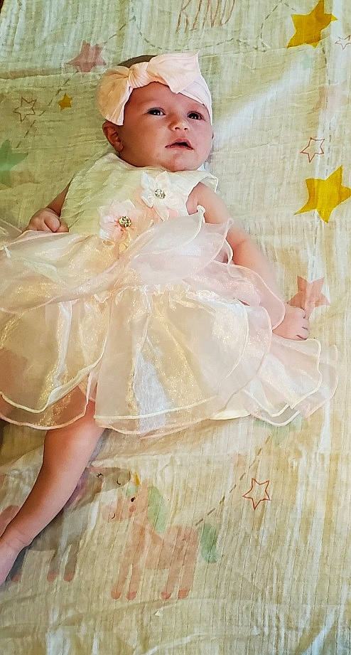 Amirah joined the competition — help win amazing prizes! baby, baby_toddler_clothing, bridal_accessory, child, day_dress, dress, embellishment, event, fashion_accessory, hair_accessory, happy, head, headband, headgear, headpiece, headwear, iris, peach, person, pink