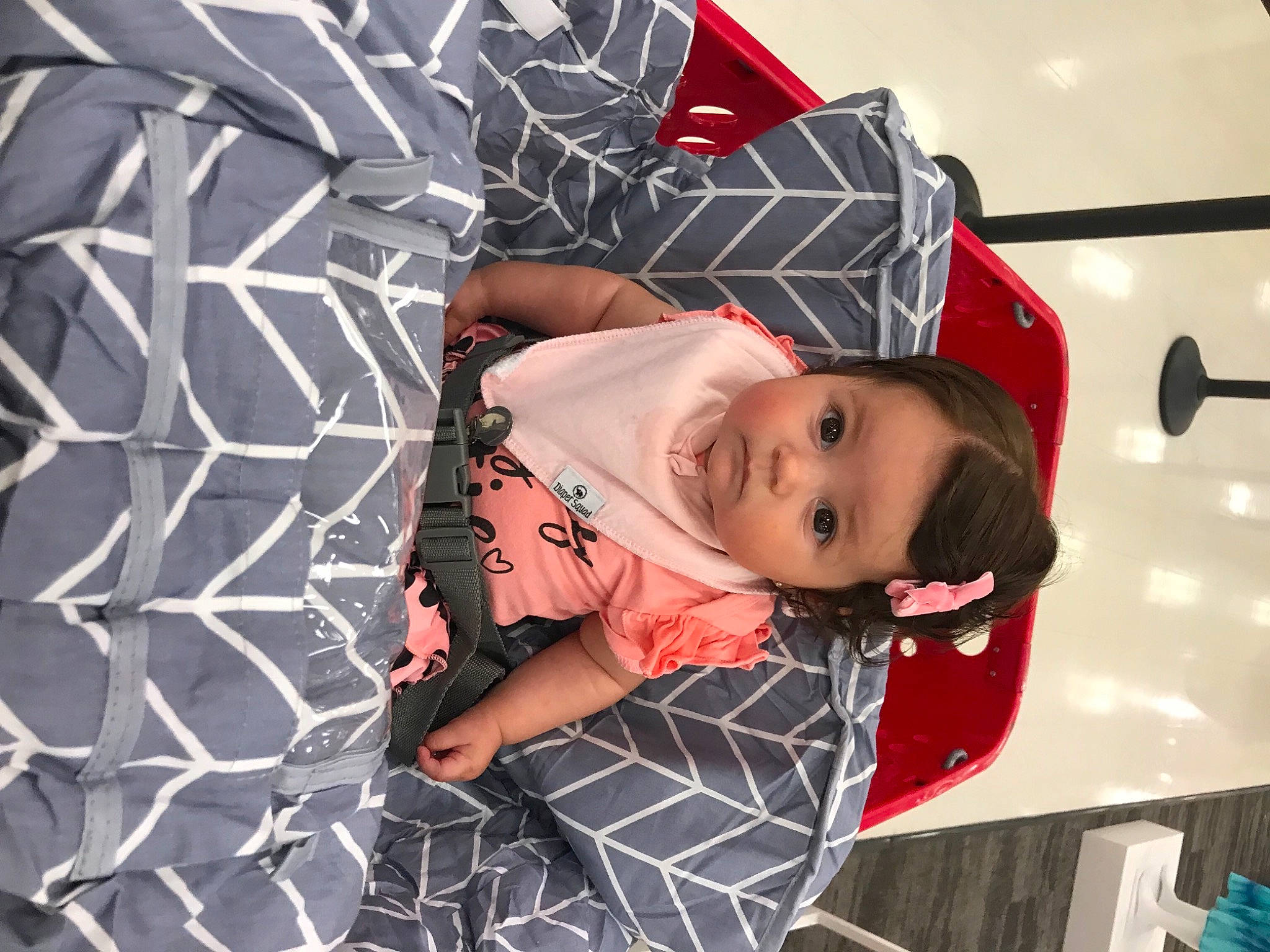Amelia joined the competition — help win amazing prizes! baby, baby_products, baby_toddler_clothing, carmine, child, comfort, fashion_accessory, fun, linens, mouth, pattern, person, plaid, sitting, sleeve, smile, toddler, vehicle_door, white