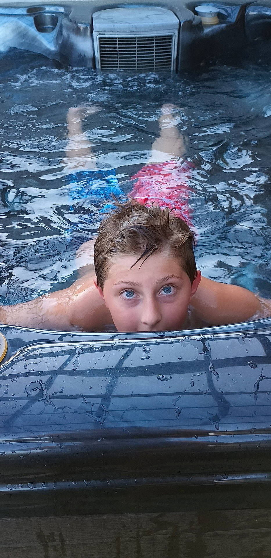 River is registered to the contest to win money with this photo: azure, barechested, chest, child, electric_blue, flash_photography, fun, games, hair, happy, human_body, leisure, muscle, person, recreation, reflection, summer, sunlight, swimming_pool, water