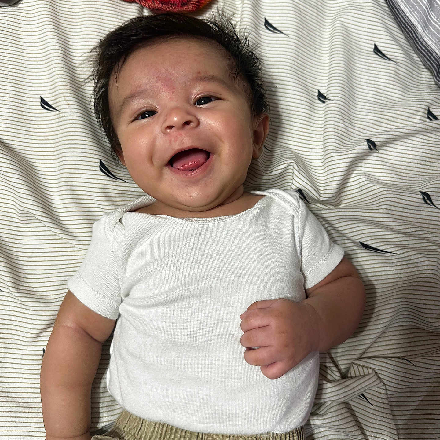 Jahziah is registered to the contest to win money with this photo: baby, babylaughing, bodypart, clothing, crying, face, finger, furniture, hand, happy, head, laughing, newborn, pants, person, photography, portrait, sad, smile, t_shirt