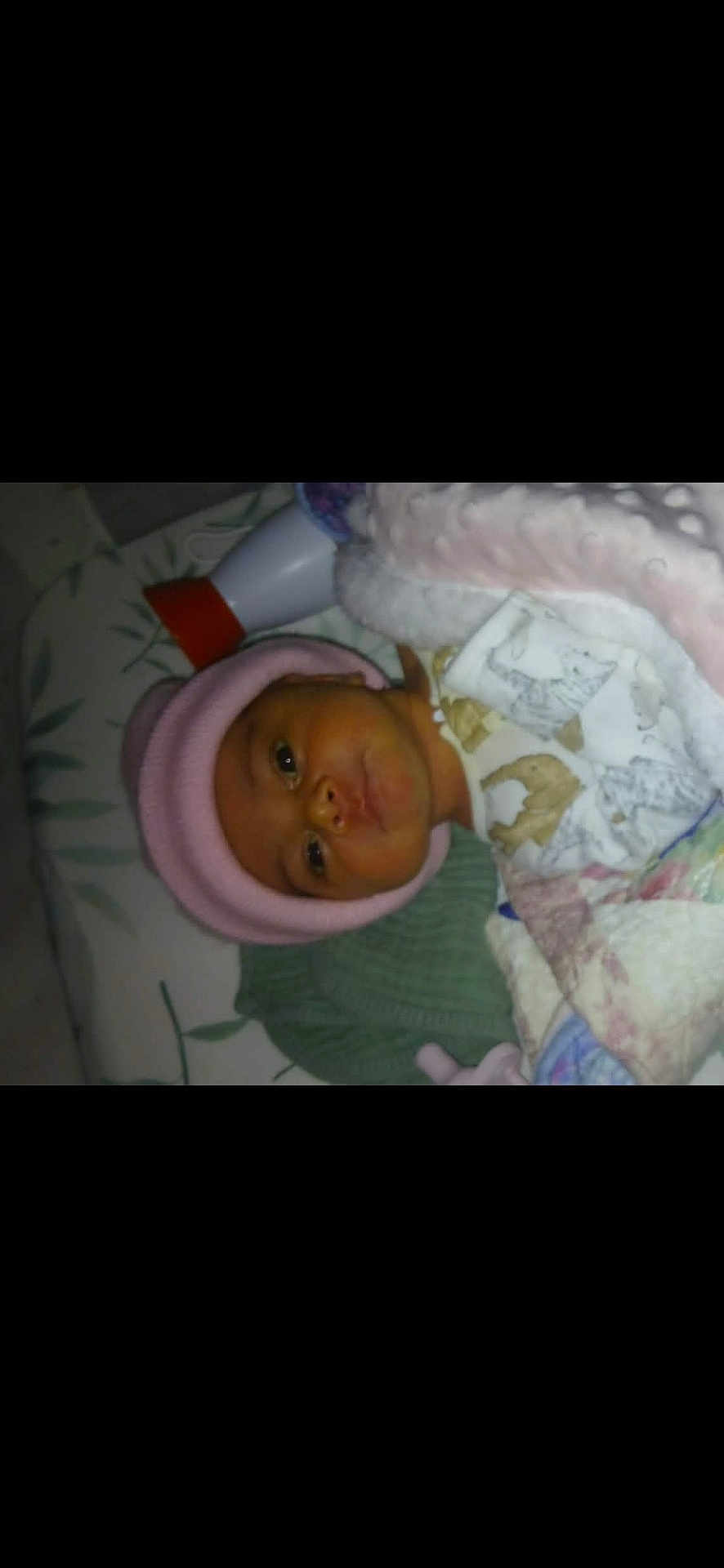 Maela joined the competition — help win amazing prizes! baby, infant, hat, blanket, bottle, laying_down, face, soft_toys, clothing, indoor, sleepwear, cute, child, newborn, portrait, resting, person, fabric, cozy, warm