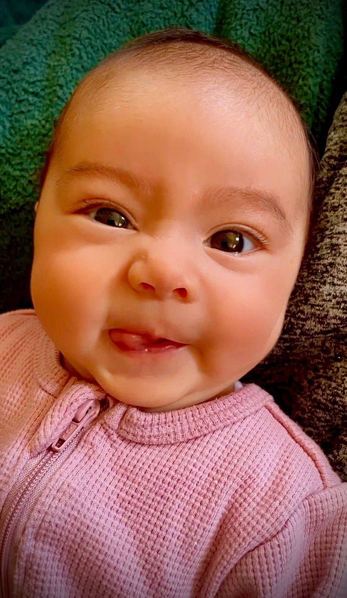 Kaliyah is registered to the contest to win money with this photo: baby, baby_toddler_clothing, cheek, child, chin, collar, ear, eyebrow, eyelash, grass, happy, iris, lip, nose, pattern, person, pink, skin, sleeve, smile
