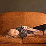 Alyza a rejoint le concours — aidez-le/la à gagner de superbes lots ! child, couch, leather, brown, smile, casual, indoor, relaxed, portrait, young, person, seated, furniture, home, cozy, comfortable, blond, long_hair, jacket, shoes