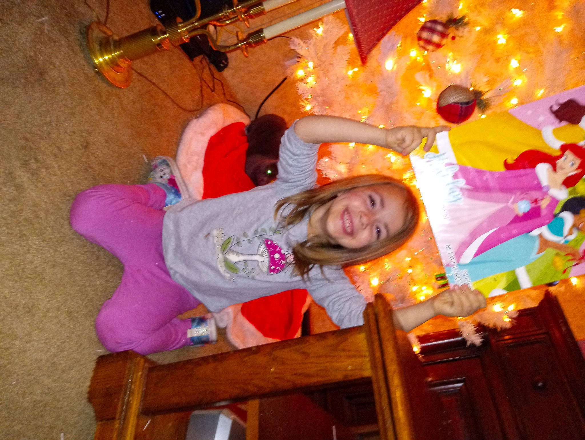 Ethel joined the competition — help win amazing prizes! child, event, flooring, fun, happy, holiday, joy, leisure, magenta, orange, party_supply, person, recreation, room, smile, toddler, tradition, tree, vacation, wood