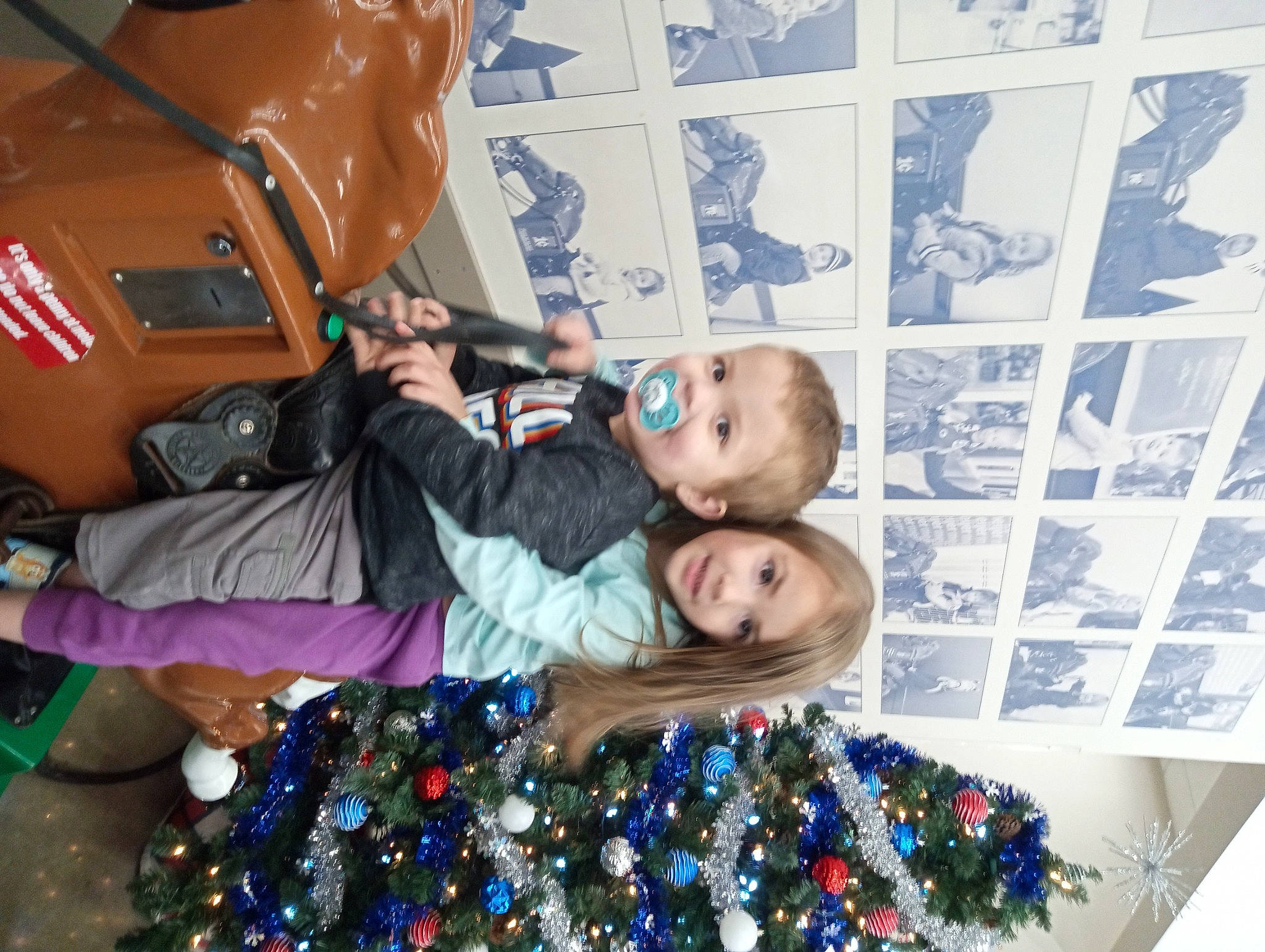 Zeke is registered to the contest to win money with this photo: bag, blue, blurred, child, christmas_decoration, christmas_ornament, christmas_tree, community, event, fun, happy, holiday, joy, leisure, luggage_and_bags, organ, ornament, people, person, photograph