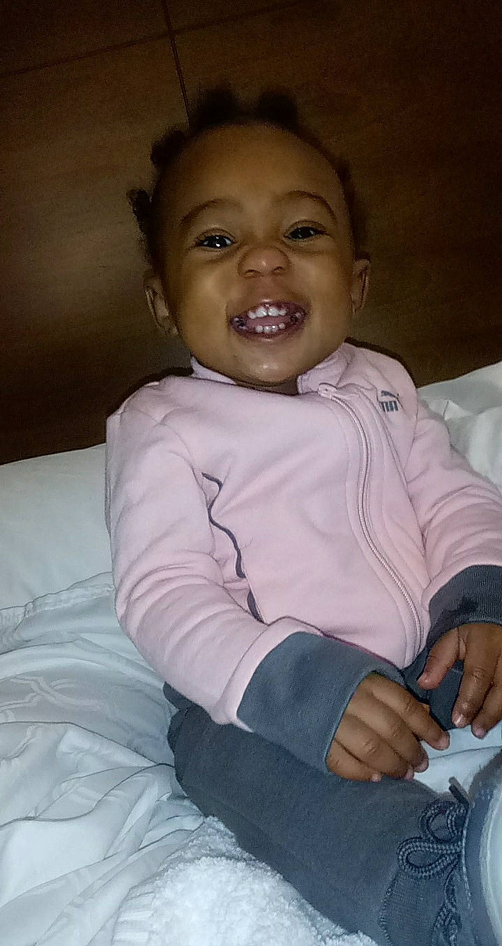 Amilliana is registered to the contest to win money with this photo: baby, cheek, child, chin, eye, face, facial_expression, fun, happy, joy, laugh, lip, nose, person, sitting, skin, smile, toddler