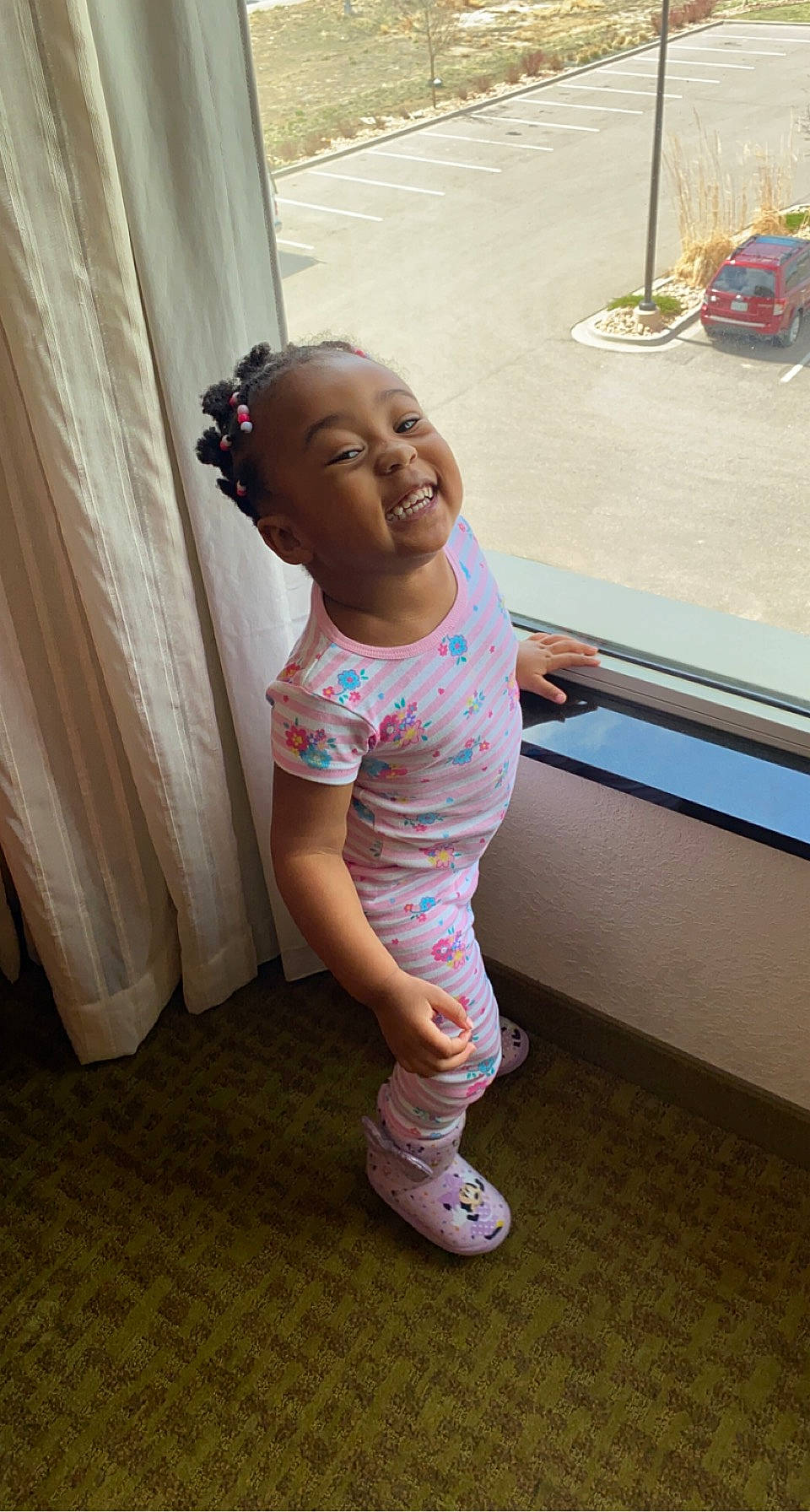 Amilliana joined the competition — help win amazing prizes! baby, baby_toddler_clothing, curtain, face, floor, flooring, fun, hand, happy, head, human_leg, joint, leg, person, sandal, skin, smile, standing, thigh, toddler