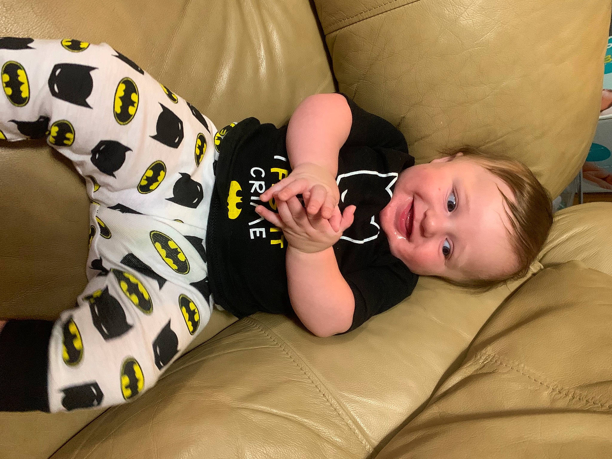 Bentley is registered to the contest to win money with this photo: baby, baby_toddler_clothing, cheek, child, comfort, facial_expression, finger, floor, flooring, hairstyle, head, headgear, joy, linens, mammal, mouth, person, sitting, skin, sleeve