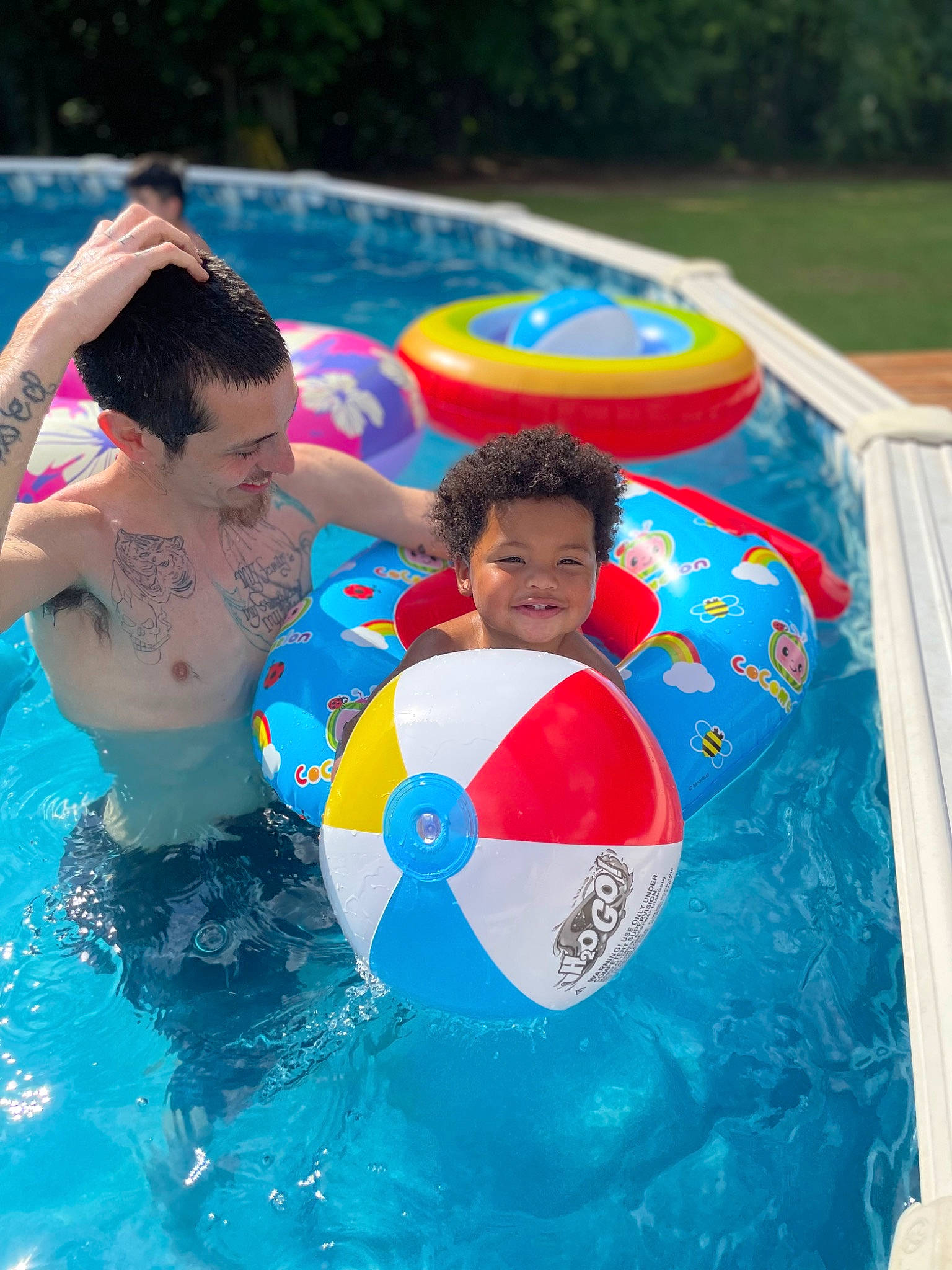 Carter is registered to the contest to win money with this photo: bathing, child, electric_blue, event, fun, games, happy, inflatable, joy, leisure, nonbuilding_structure, person, personal_protective_equipment, play, recreation, smile, swimming_pool, toddler, vacation, water