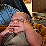 Wylde is registered to the contest to win money with this photo: baby, blanket, child, clothing, cozy, cute, face, furniture, hand, home, indoor, infant, peaceful, person, portrait, relaxing, room, skin, sleeping, toddler