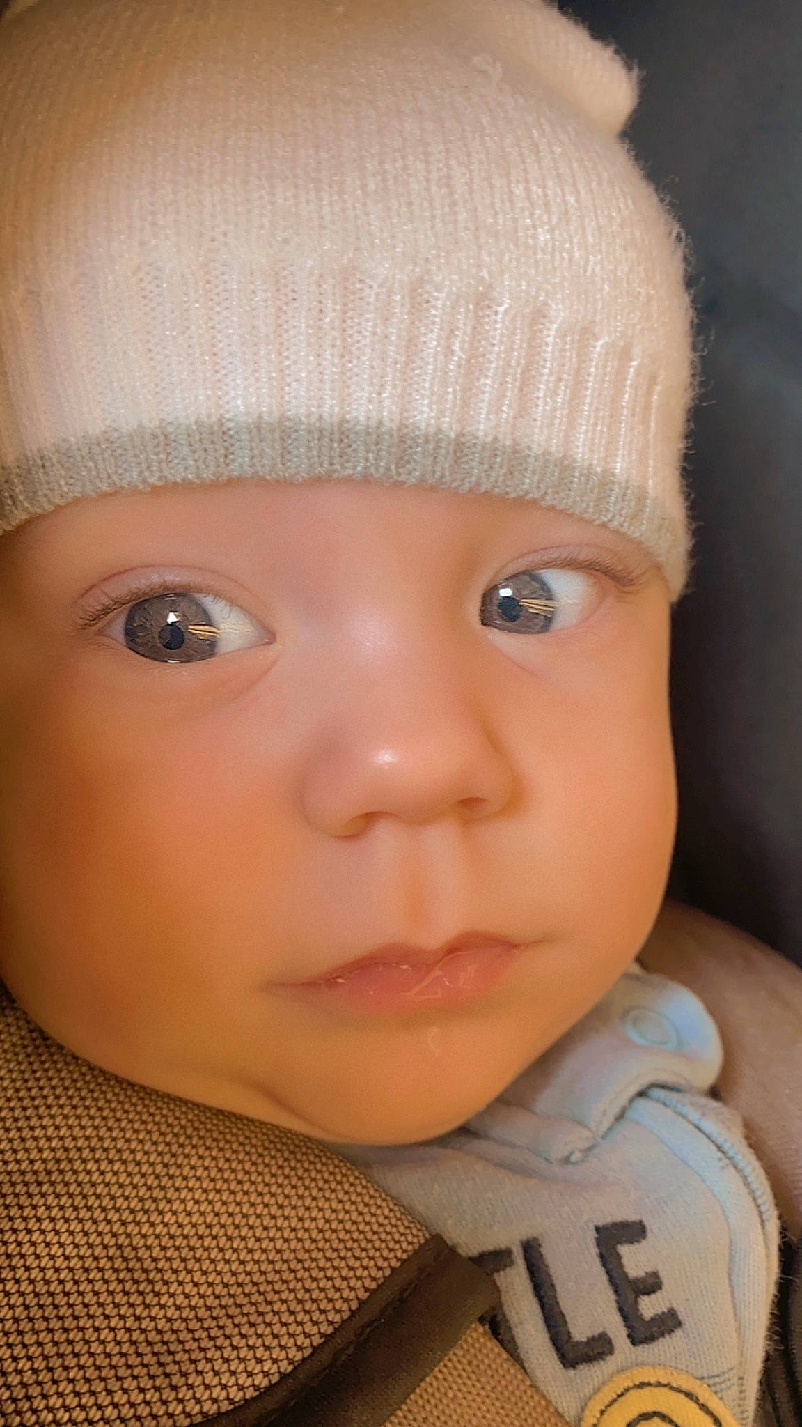 Jax is registered to the contest to win money with this photo: baby, beige, cap, cheek, child, chin, cool, eye, eyebrow, eyelash, face, hat, headgear, headwear, knit_cap, lip, nose, outerwear, person, skin